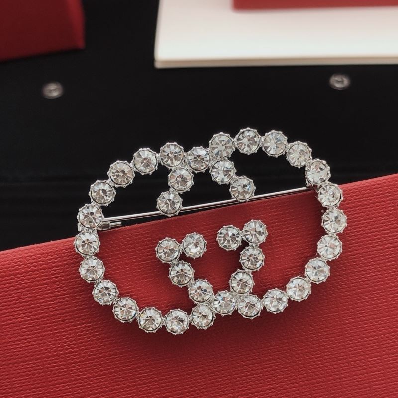 Gvc*1 brooches